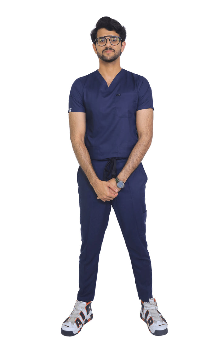 Doctor wearing blue cotton scrub in a hospital hallway