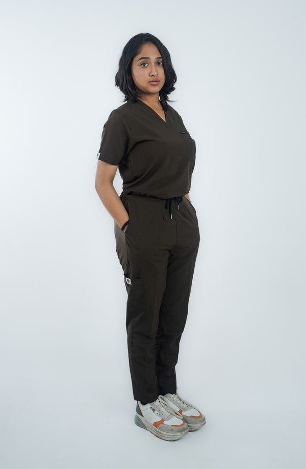 Front view of female nurse in Midnight Brown ScrubyHub scrubs