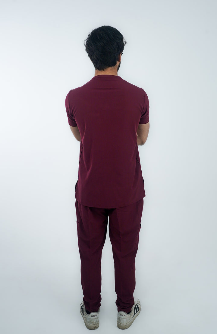 Back angle of a male doctor showcasing the perfect fit of ScrubyHub scrubs.