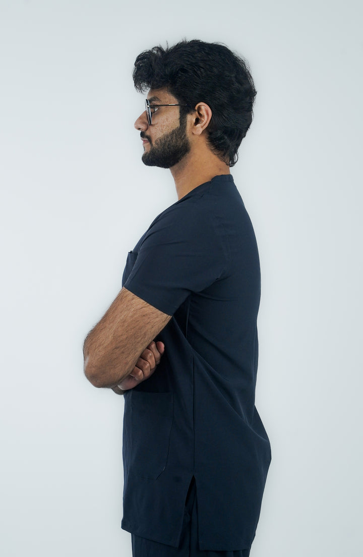 Side profile of male nurse in Midnight Ocean Wave Scrubs showcasing the perfect fit – ScrubyHub.