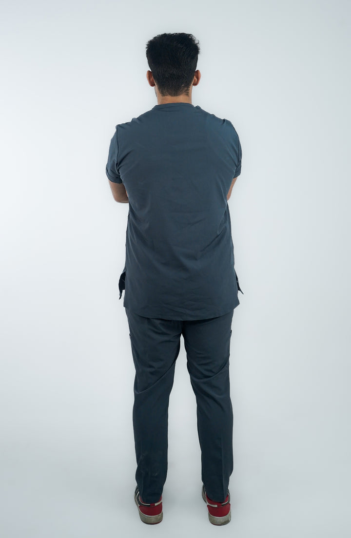 Back view of male model showcasing fit and cut of ScrubyHub’s Midnight Slate Gray Scrubs.