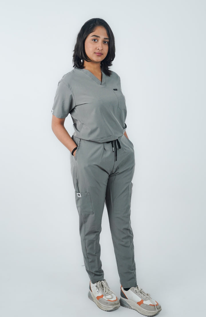 Front view of female nurse in Midnight Slate Silver Scrubs by ScrubyHub
