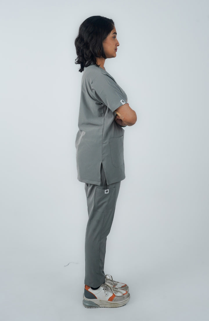 Side view of female doctor wearing Midnight Slate Silver Scrubs - ScrubyHub