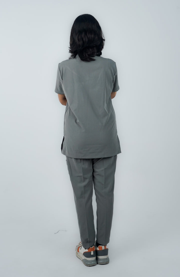 Back view of female model in Midnight Slate Silver Scrubs highlighting the tailored fit