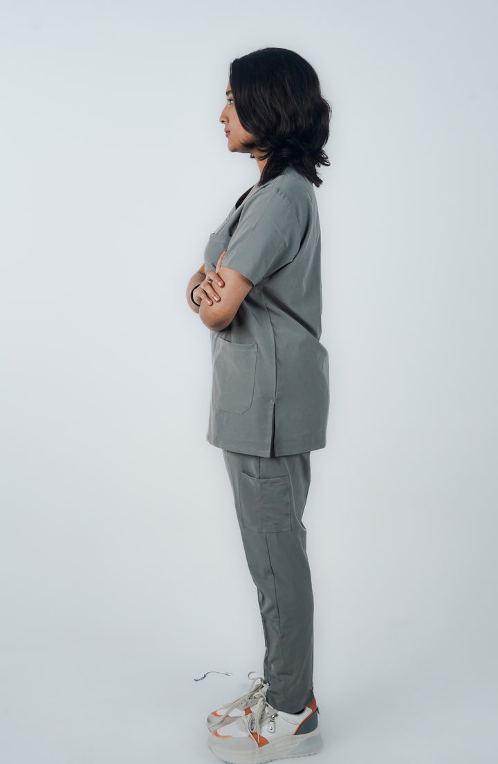 Side view of female doctor wearing Midnight Slate Silver Scrubs - ScrubyHub