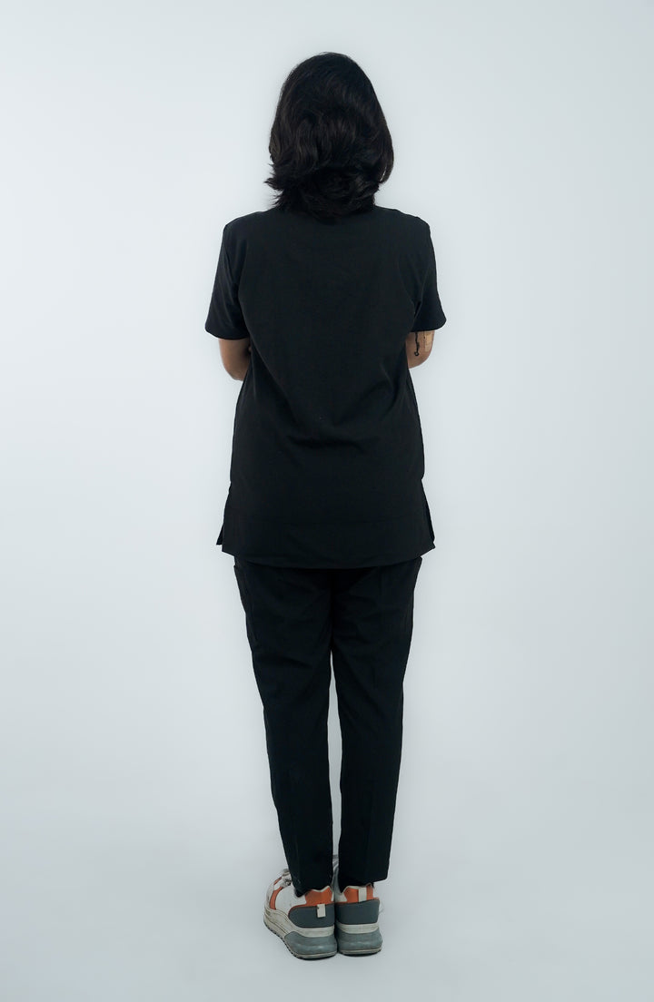 Rear view of female practitioner in Midnight Black Charm Scrub – ScrubyHub
