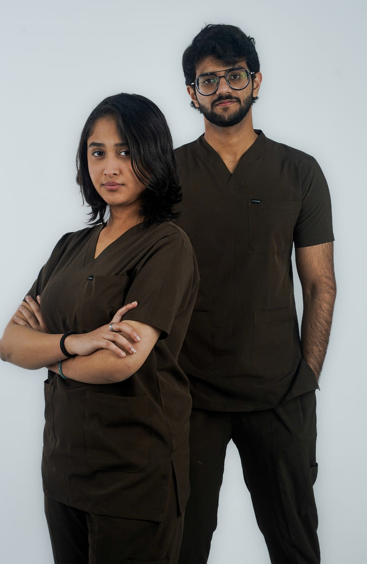 Healthcare team (male and female) side view in coordinated Midnight Brown scrubs