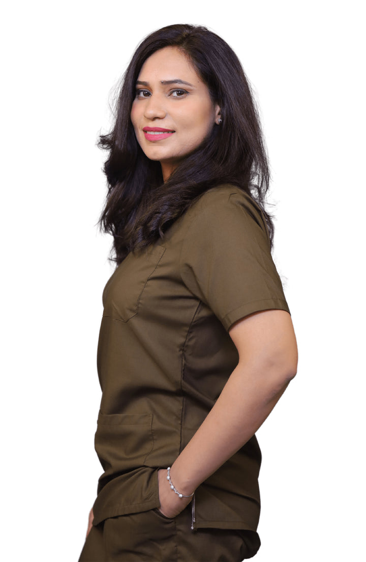 Confident female doctor wearing ScrubyHub’s green medical scrub with pockets and V-neck design
