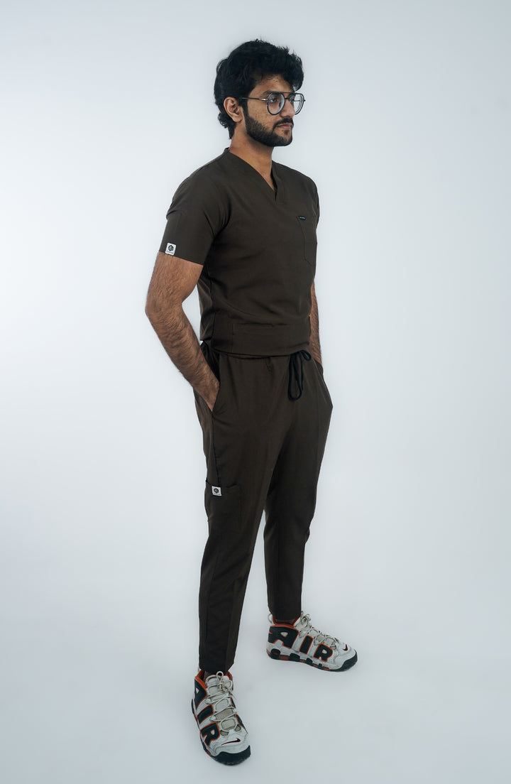 Side view of male model in Midnight Brown medical scrub set