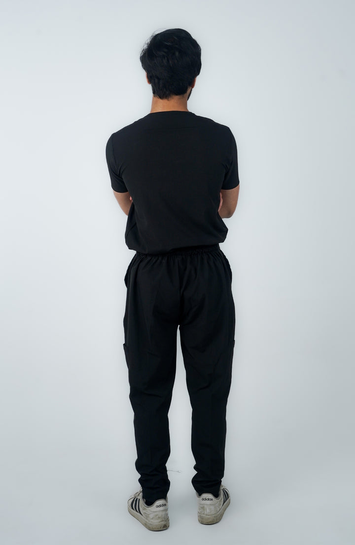 Back view of male healthcare worker in Midnight Black Charm Scrub – ScrubyHub
