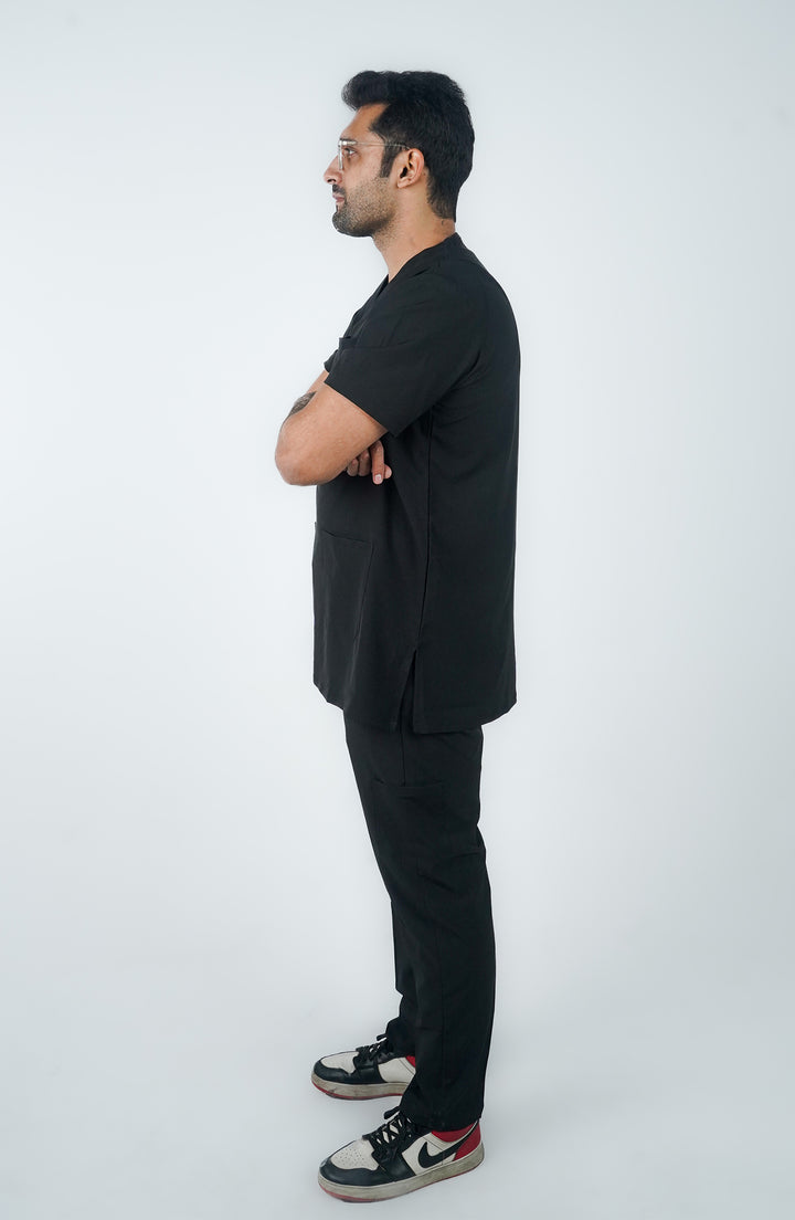 standing man black wearing scrub midnight